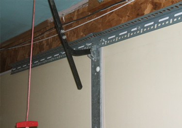 garage door bracket repair in in Tarzana