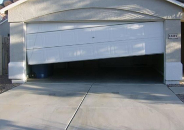 garage door off track repair in in Tarzana